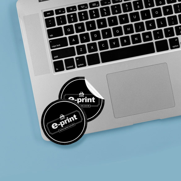 black and white circular stickers have a non-reflective paper surface and feature a brand logo and company website. 